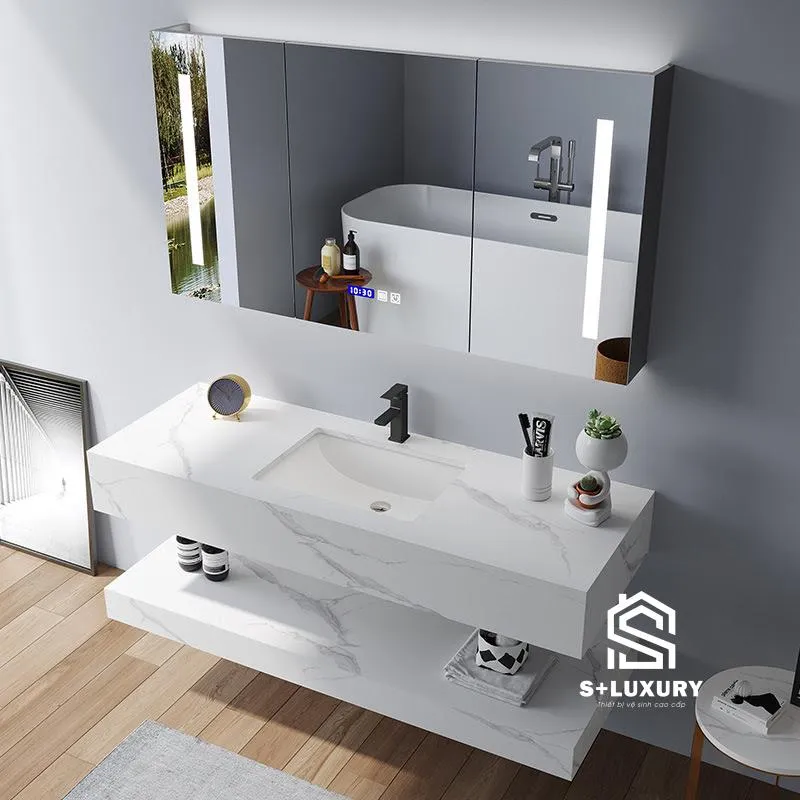 Bàn đá chống xước 2 tầng Bàn đá chống xước 2 tầng, bề mặt nhám kết hợp chậu sứ âm, vòi nóng lạnh và tủ gương led.